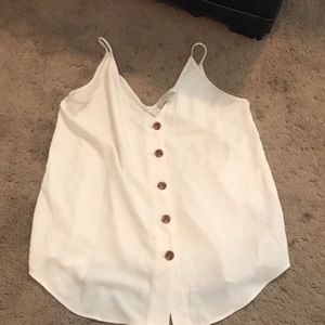 White top with brown buttons